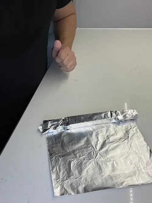 wrapped brisket with aluminum foil step 3